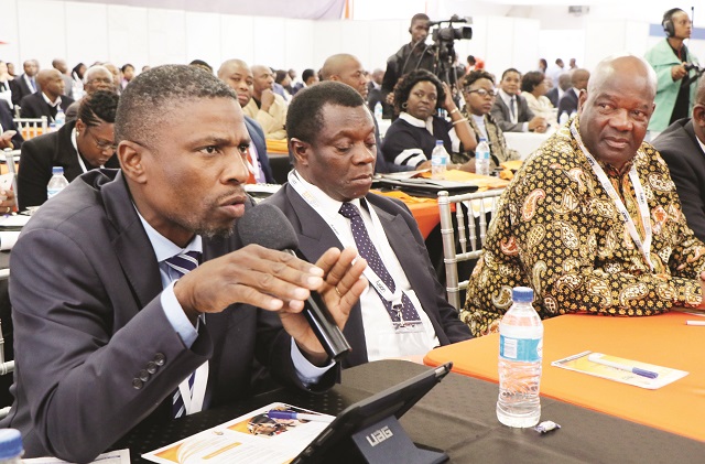 The Parliamentary Portfolio Committee on Transport and Infrastructural Development chairman Mr Dexter Nduna poses a question to Vice President Mnangagwa (out of picture) during the International Business Conference at the ZITF, last week. Listening are TSCZ managing director Mr Obio Chinyere and Deputy Minister of Agriculture (Livestock) Cde Paddy Zhanda. —Picture by Eliah Saushoma