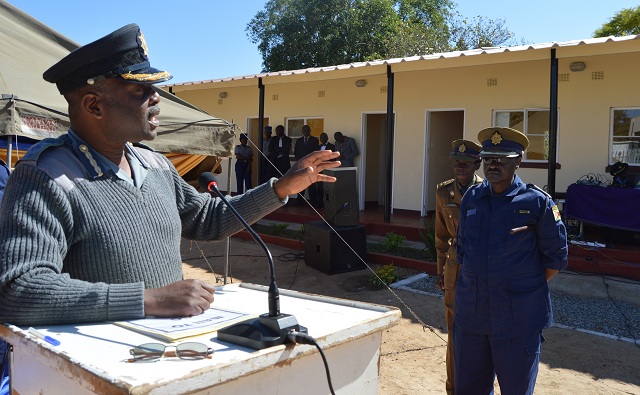 Snr Asst Comm Stephen Mutamba (left) speaks during the opening of Magwegwe Police Station on Wednesday