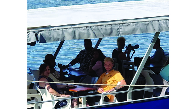 Tourists throng Victoria Falls