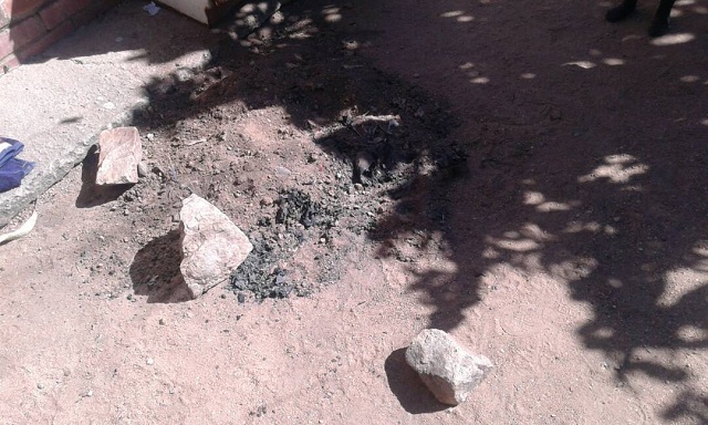 Stones and rubble which were placed in the bucket to cover the baby