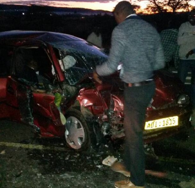 A man inspects the car which Gweru magistrate Mr Tendai Madanhire was driving at the scene of the accident yesterday