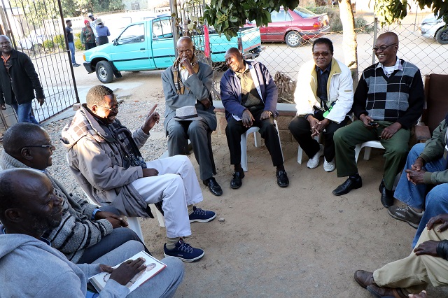 Mourners gather at the late Sigoge Mlotshwa house in Lobengula West.