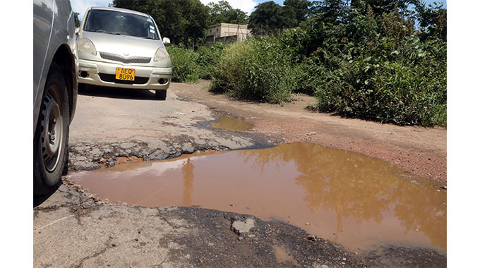 Pictures of vehicles ‘sinking’ in potholes shock the city