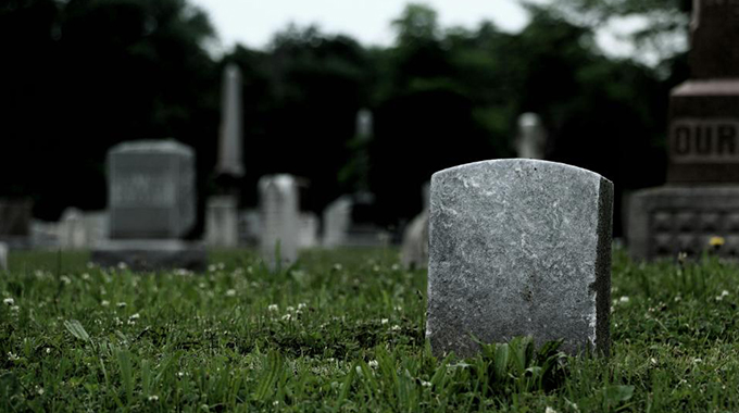 Baby corpse found outside grave