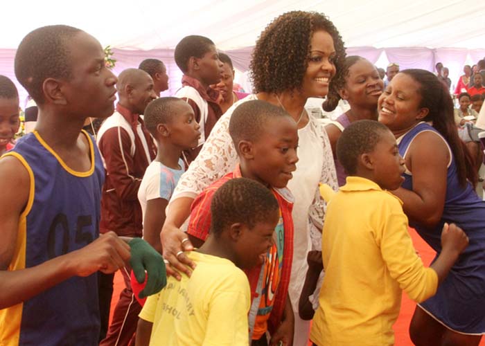 Amai Mugabe stands with the needy
