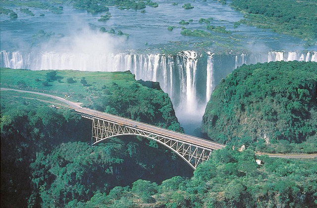 What is slowing tourism in Zimbabwe?