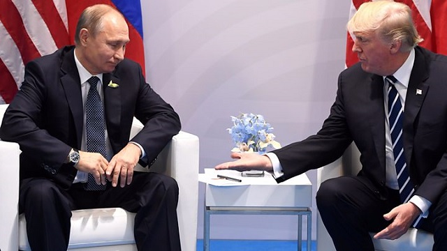 Putin threatens US over Russia media attacks