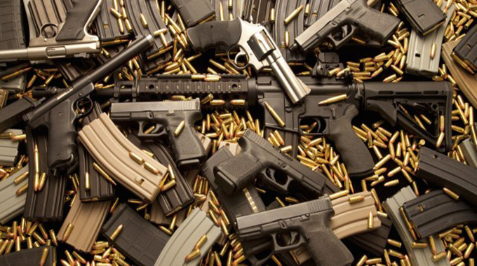 Cops nabbed with 15 guns, 185 bullets