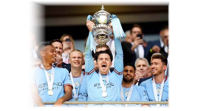 Man City’s treble dream lives on
