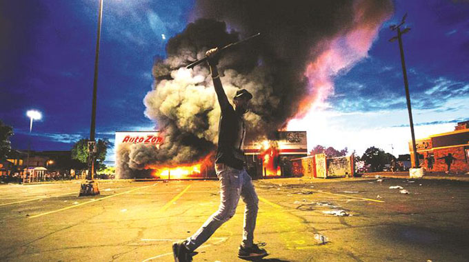 Minneapolis wakes up to smoke, destruction after police death riot