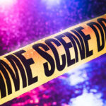 The woman has been arrested while two of the deceased’s employees remain on the run