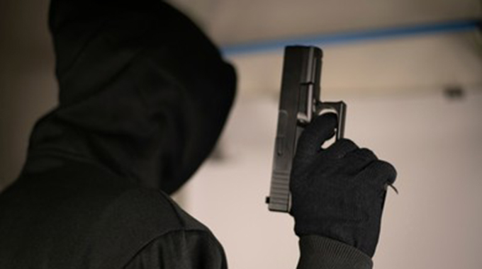 The suspects were armed with pistols and concealed their identities with black balaclavas