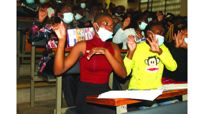 UZ sign language students help vendors