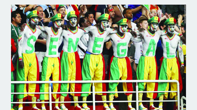BRILLIANT LIONS OF TERANGA . . . Africa smiles as Senegal cruise into last 16