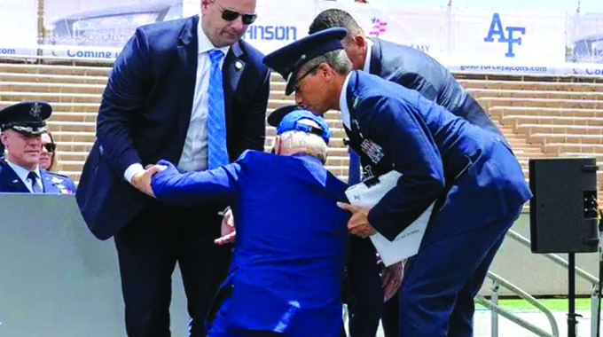 Biden slips and falls at ceremony