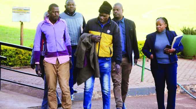 Two suspected armed robbers in dock for stealing US$74 000