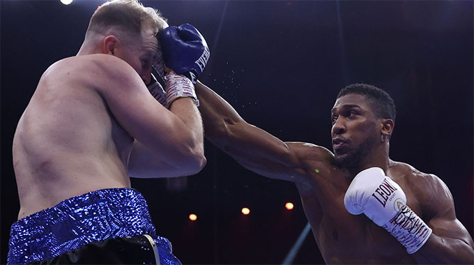 Anthony Joshua wins in five