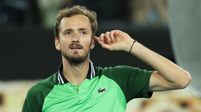 Medvedev moves past Cobolli