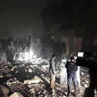 Air strike flattens Gaddafi compound