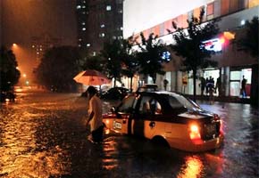 Beijing gets heaviest rains in six decades