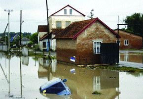 Russia mourns flood dead as questions mount