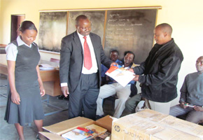 Varsity donates books to Landa J High School