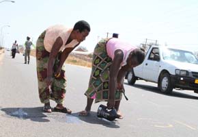 Women ordered to clean graffiti on road
