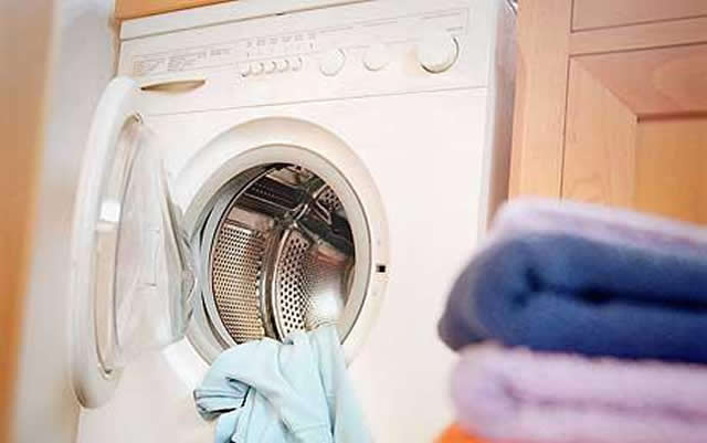 Naked man gets stuck in washing machine