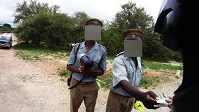 Bribes police officer arrested