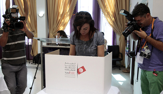 Tunisians vote in landmark polls