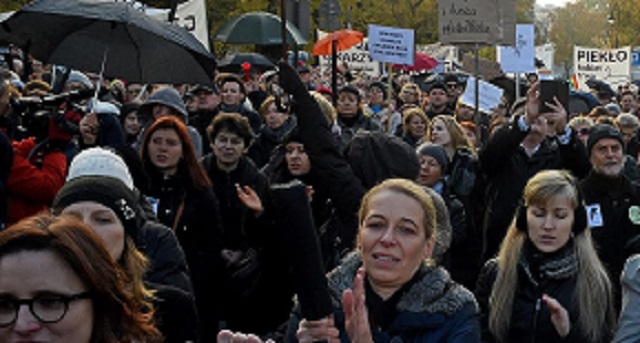 Poles join ‘umbrella protest’ against abortion curbs