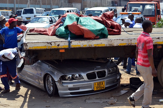 BMW rams into haulage truck