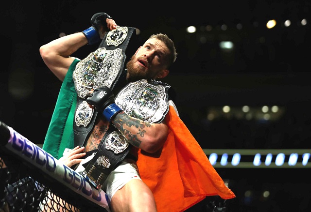 McGregor claims historic second title at UFC 205