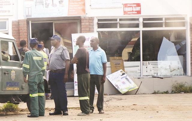 Cop drives into shop