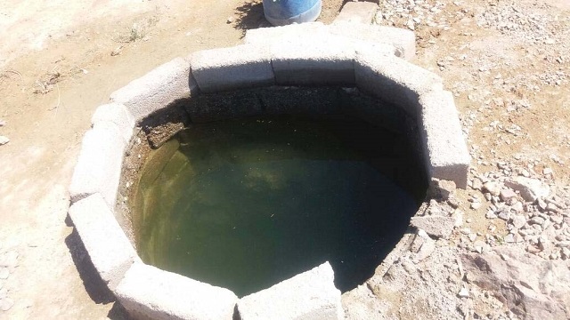 The boy was attempting to cross a deep well using a log placed across it