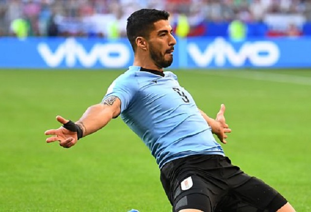 Uruguay ease past Russia, tops Group A