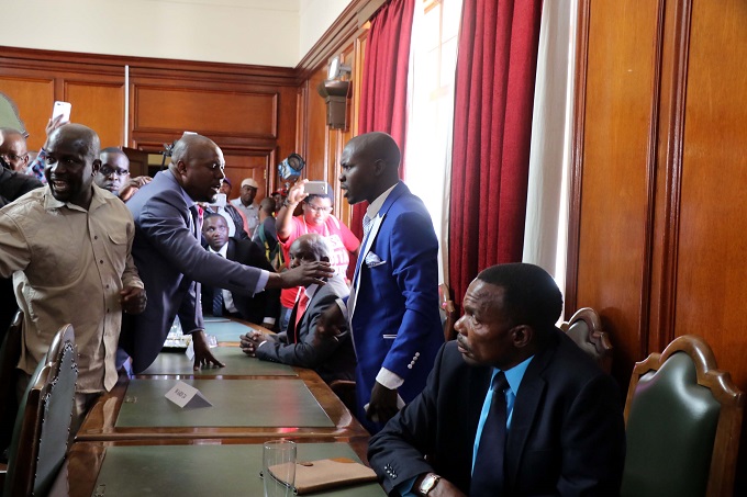 WATCH: Swearing-in event turns violent: Councillor takes oath of office ‘drunk’. . . Angry activist slaps late-comer councillor