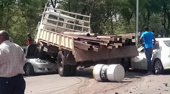 Truck rams roadblock, injures 7