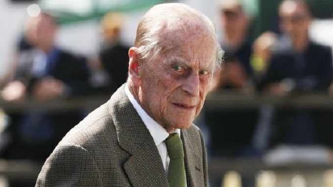 Prince Philip unhurt in crash while driving
