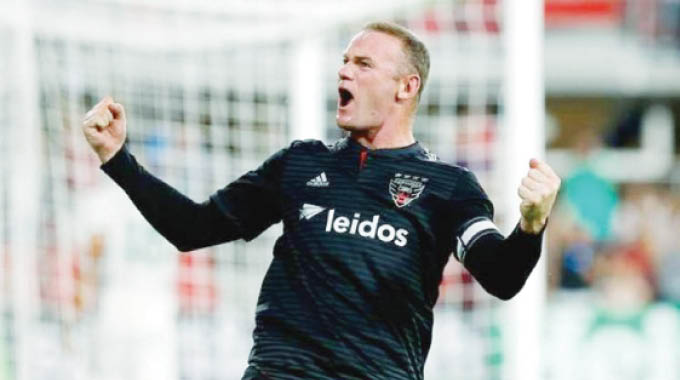 Wayne Rooney signs player-coach deal
