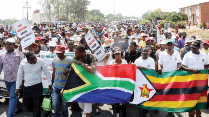 Thousands march against sanctions