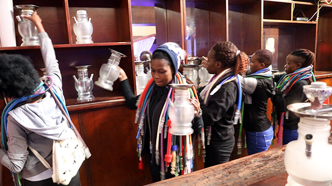 COMMENT: Ensure bars, nightspots do not allow patrons to drink from inside