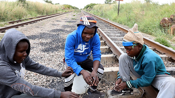 Picture of the day: Weather boys warm themselves offbeat