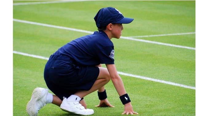 Ball boys move the game of football