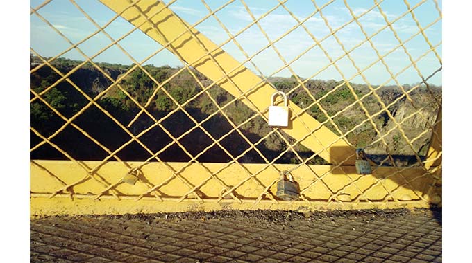 Love locks craze at Vic Falls bridge