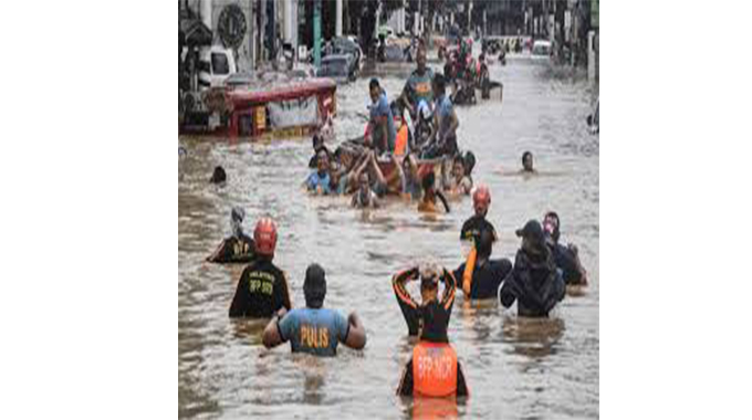 Philippines scrambles to rescue thousands from typhoon flooding