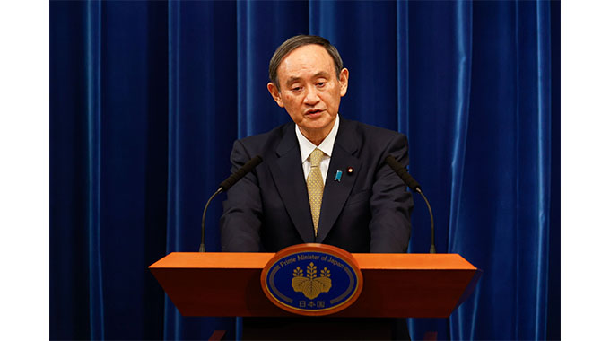 Japan prime minister vows to press ahead with Olympics despite coronavirus surge