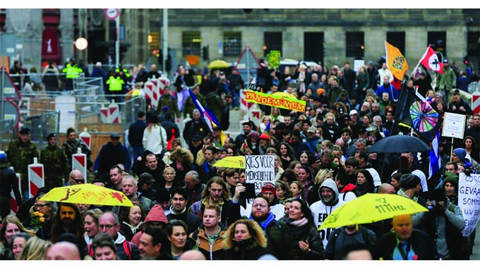 Covid protests in Netherlands turn violent for a second night