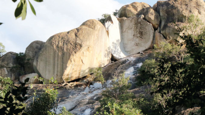 Balancing rock splits and falls at Njelele shrine