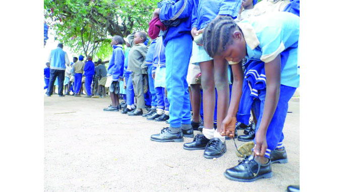 Temp teacher touched by barefoot schoolchildren